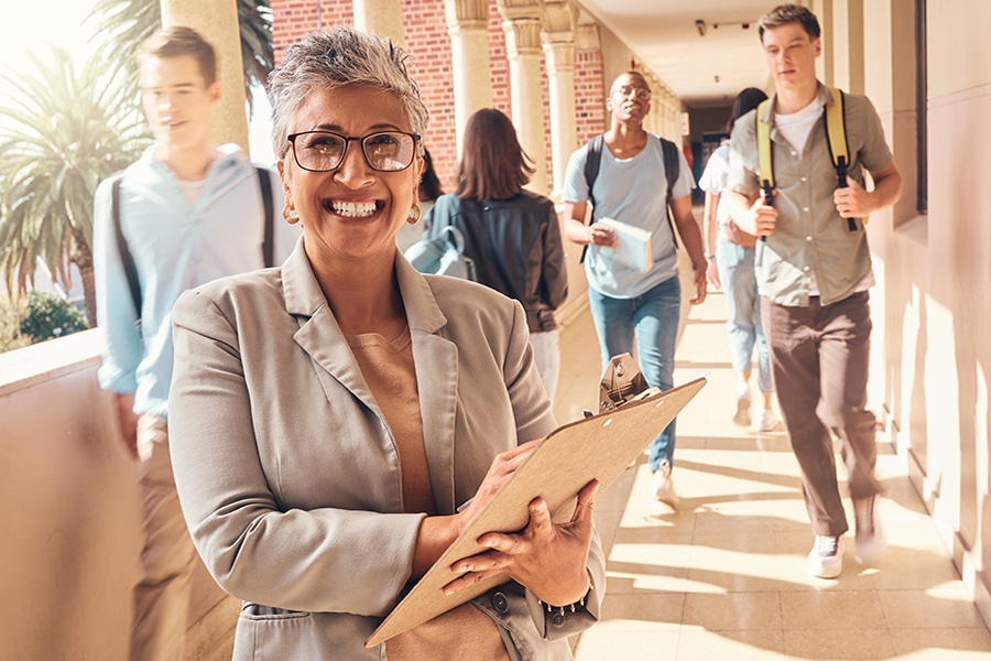 software solution for school administrator holding a clipboard